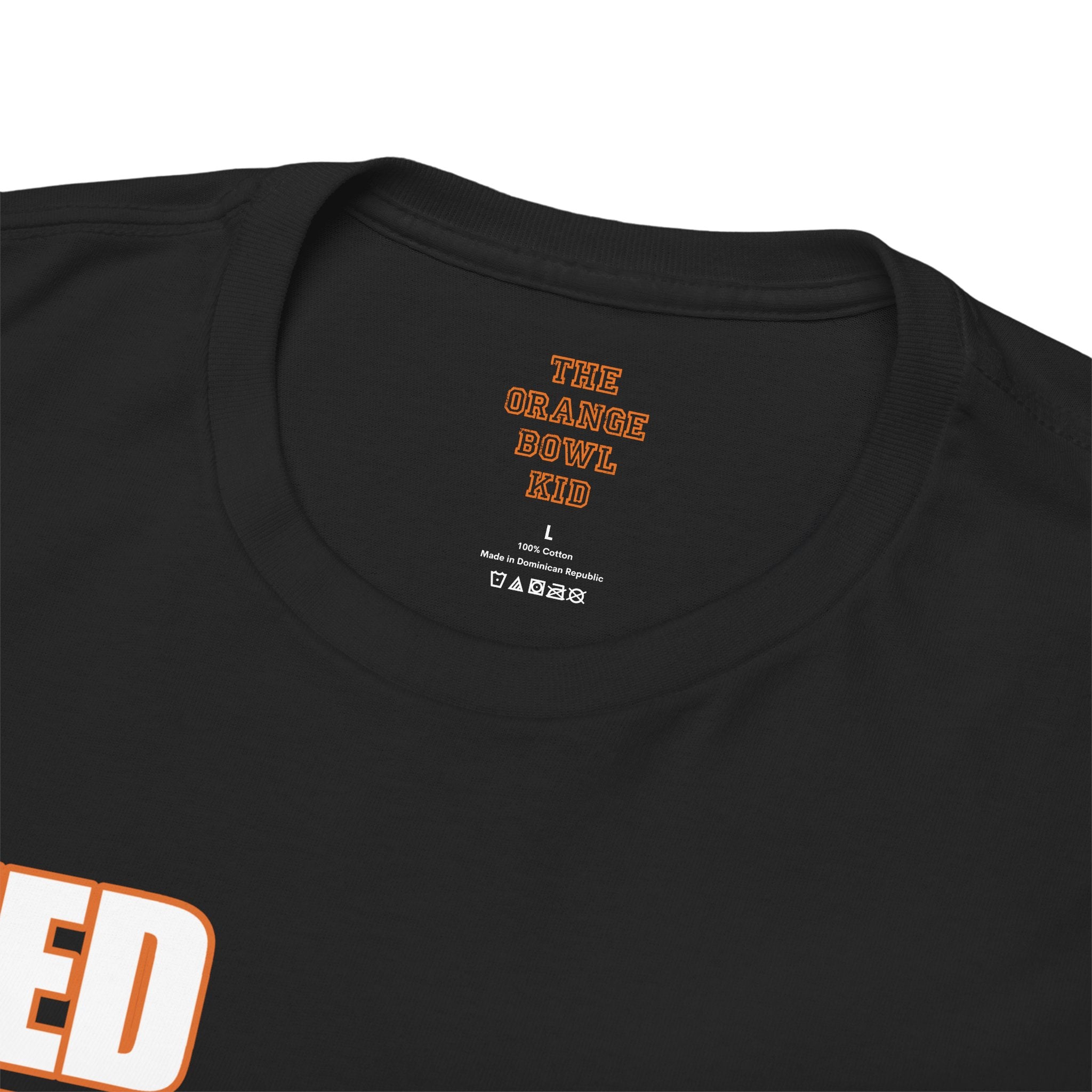 Detailed close-up showcasing the inside tag of the Miami Hurricanes 2001 Greatest Team graphic tee, highlighting the product information, care instructions, and perhaps even a subtle nod to the iconic team's legacy through the tag's design or placement, offering a glimpse into the quality and authenticity of this commemorative piece.