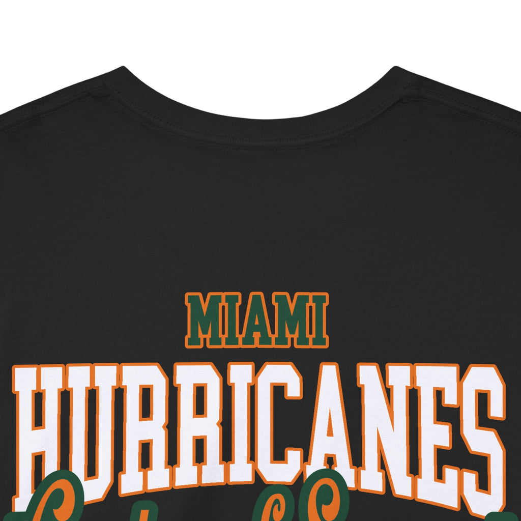 1987 UM Football, Creators of Swagger, Miami Sports Apparel, Vintage Streetwear, Retro Championship Shirt, Orange Bowl Kid, Urban Aesthetic, Collegiate Graphics, OBK. Black shirt with 'Miami Hurricanes' text in white and green on a white background.