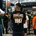 1987 UM Football, Creators of Swagger, Miami Sports Apparel, Vintage Streetwear, Retro Championship Shirt, Orange Bowl Kid, Urban Aesthetic, Collegiate Graphics, OBK. 